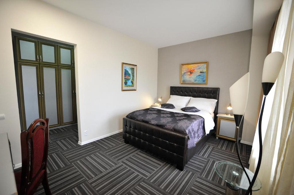 Postel nebo postele na pokoji v ubytování ZP Hotel
