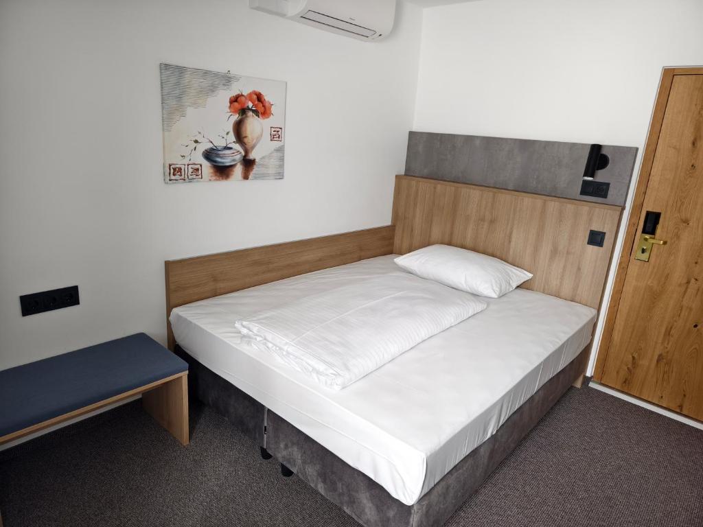 Postel nebo postele na pokoji v ubytování Hotel Anker
