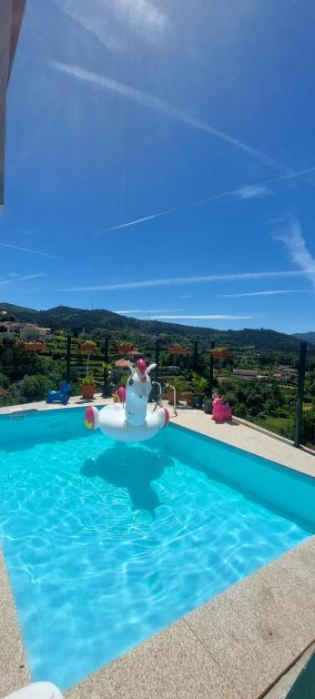 a swimming pool with a view of the mountains at Casa do Vale in Arcos de Valdevez