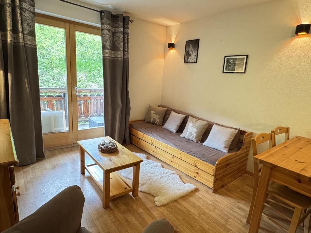 a living room with a couch and a table at Pracondu 2 207 - OUTDOOR & FUN apartment 4 pers in Nendaz