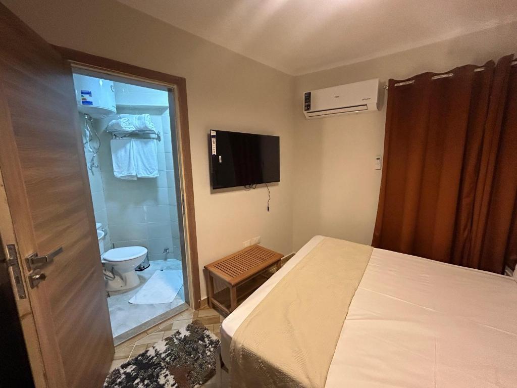 Postel nebo postele na pokoji v ubytování Stayline hotel apartments 5 mins from Cairo airport