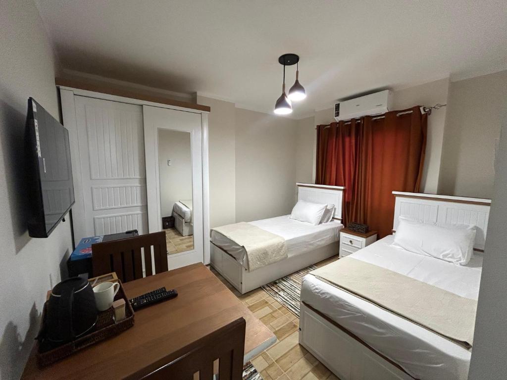 Postel nebo postele na pokoji v ubytování Stayline hotel apartments 5 mins from Cairo airport