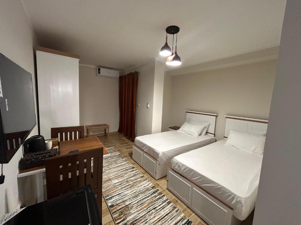Postel nebo postele na pokoji v ubytování Stayline hotel apartments 5 mins from Cairo airport
