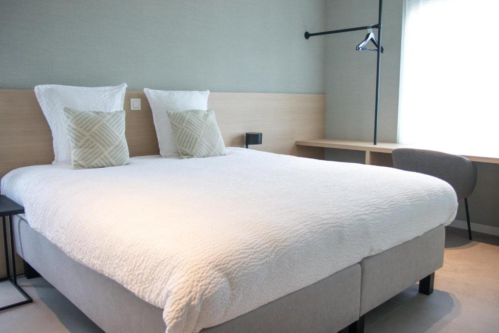 Postel nebo postele na pokoji v ubytování B&B Abdeshof