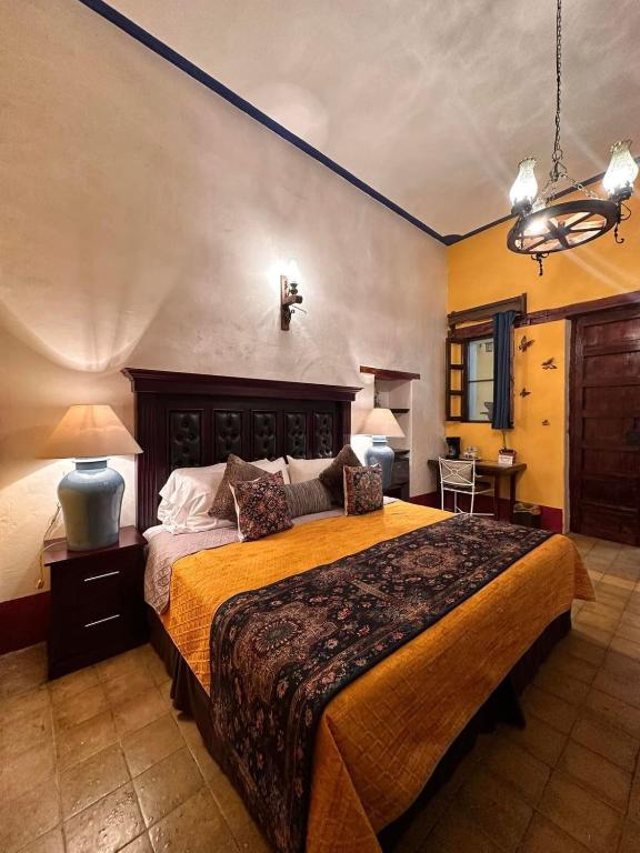 Postel nebo postele na pokoji v ubytování Copa de Oro Hotel Boutique