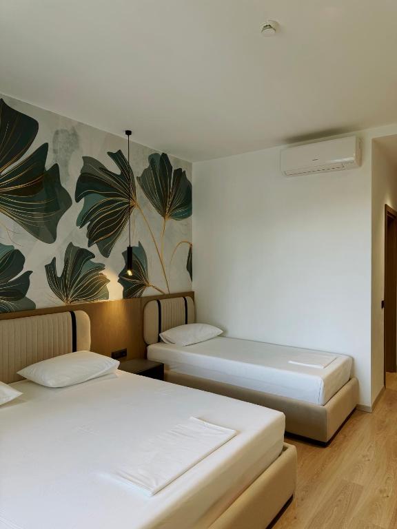 Postel nebo postele na pokoji v ubytování Monun Hotel