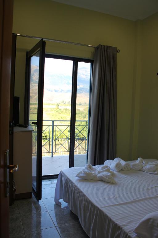 Postel nebo postele na pokoji v ubytování Hotel Mondo