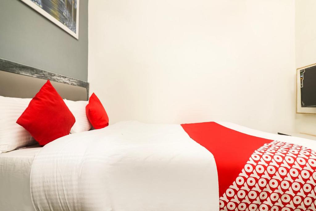 Postel nebo postele na pokoji v ubytování Hotel O Sheela
