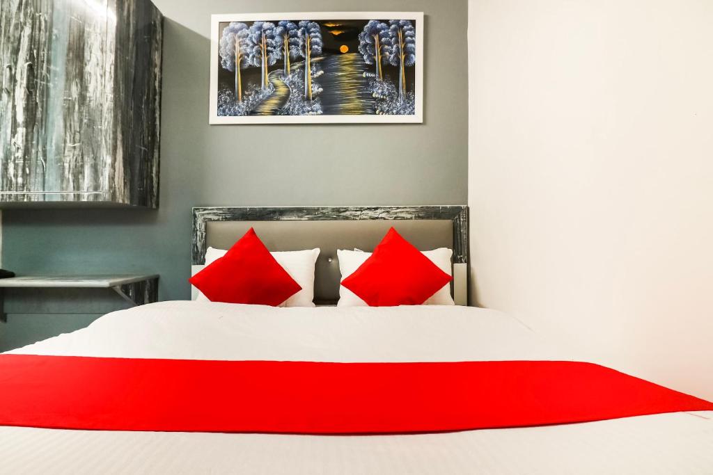 Postel nebo postele na pokoji v ubytování Hotel O Sheela