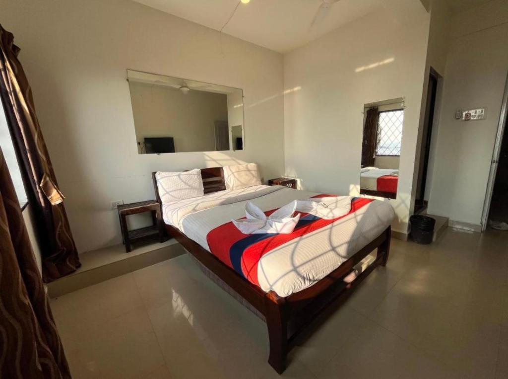 Postel nebo postele na pokoji v ubytování Mehar Rooms