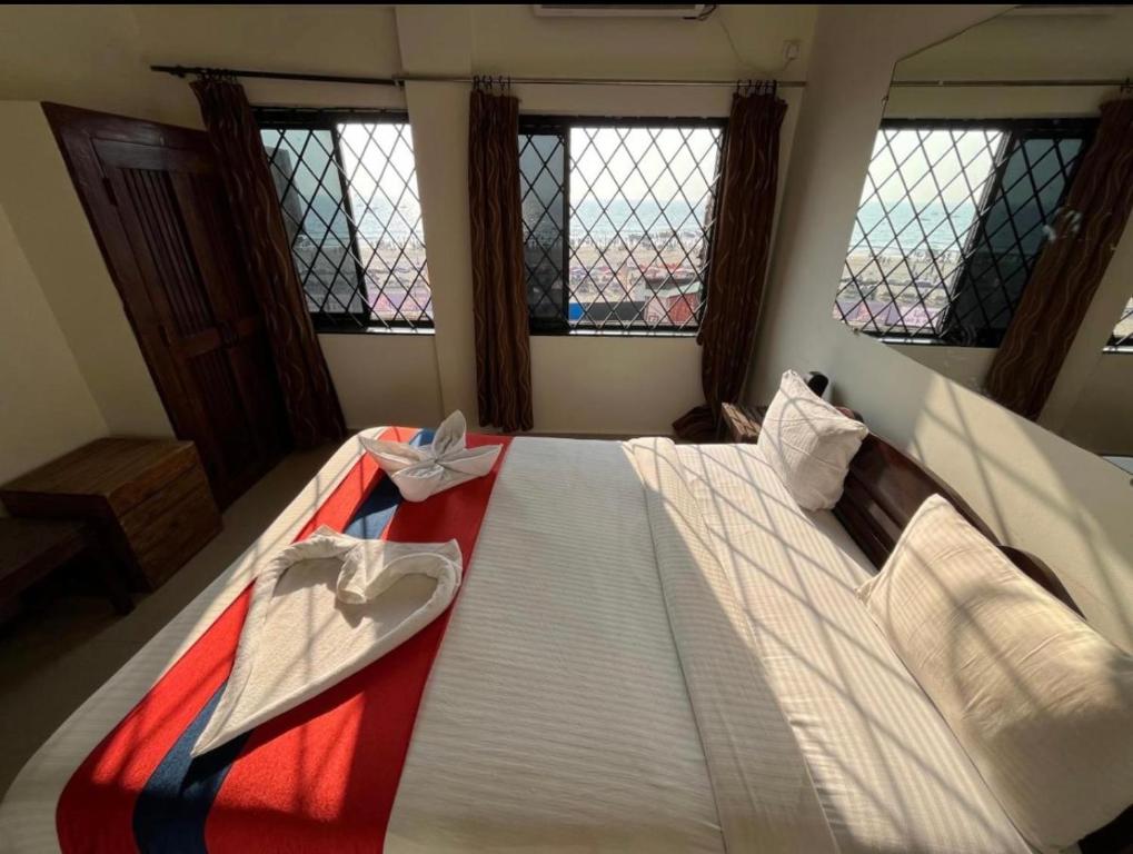 Postel nebo postele na pokoji v ubytování Mehar Rooms