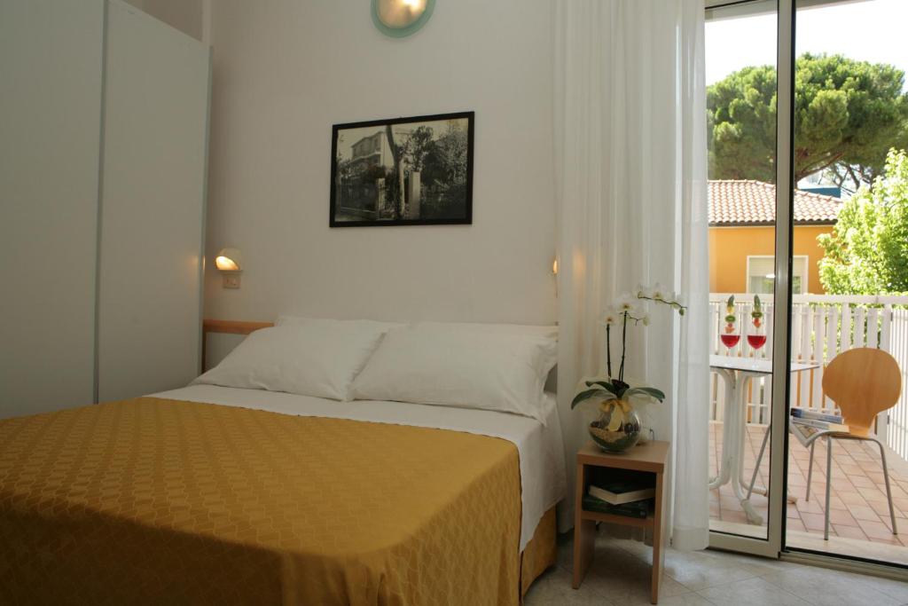 Postel nebo postele na pokoji v ubytování Hotel Giuliana