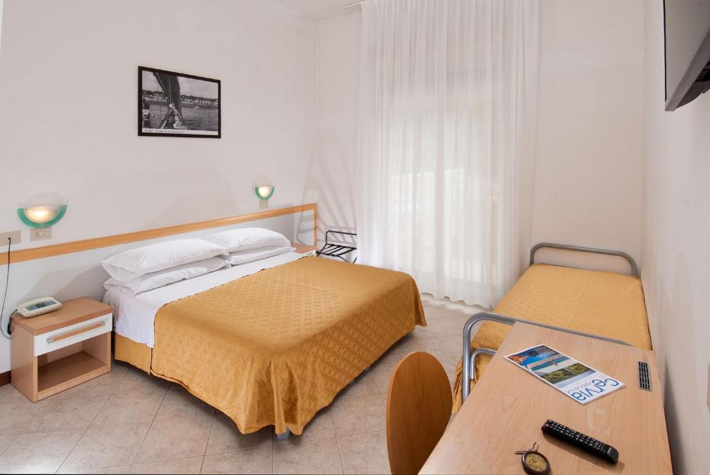 Postel nebo postele na pokoji v ubytování Hotel Giuliana