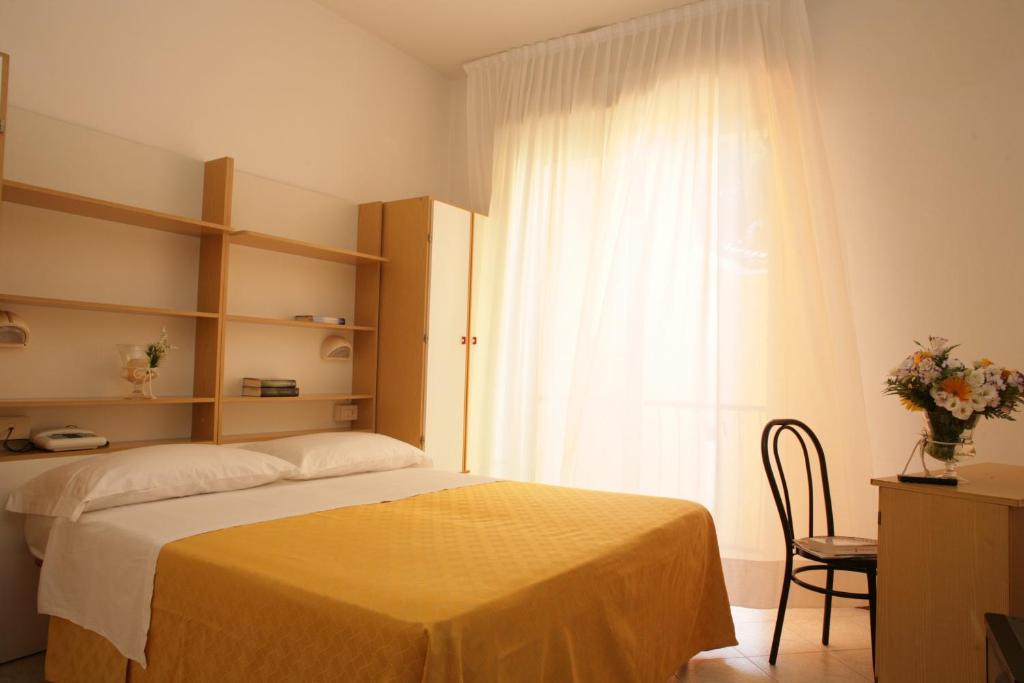 Postel nebo postele na pokoji v ubytování Hotel Giuliana