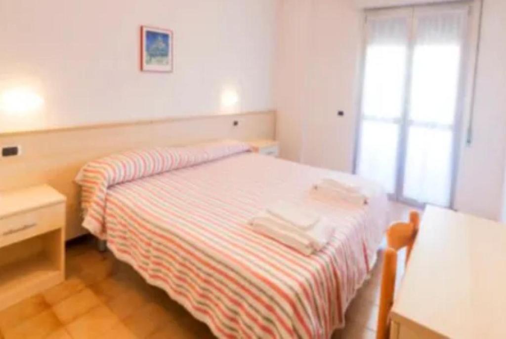 Postel nebo postele na pokoji v ubytování Hotel Holiday Garnì