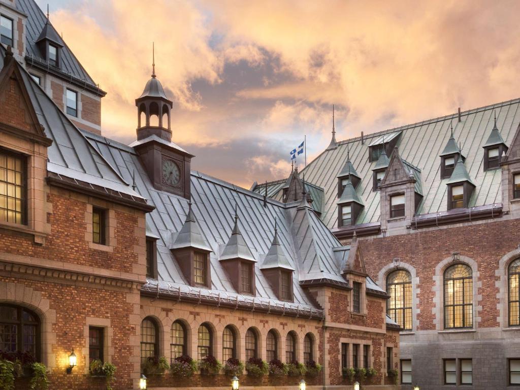 a building with a clock tower on top of it at Fairmont Le Chateau Frontenac in Quebec City