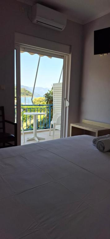 Postel nebo postele na pokoji v ubytování Elena Hotel