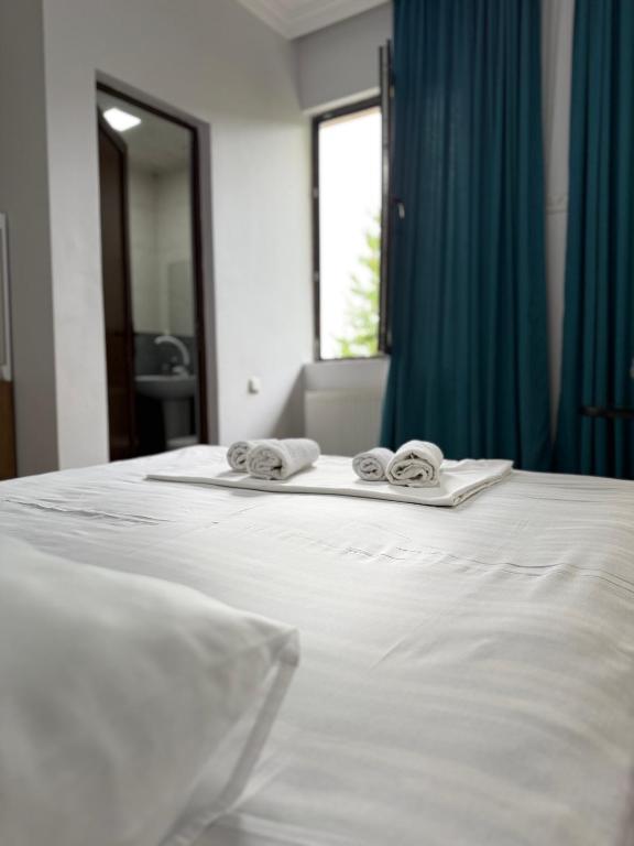 Postel nebo postele na pokoji v ubytování Lia Guest House