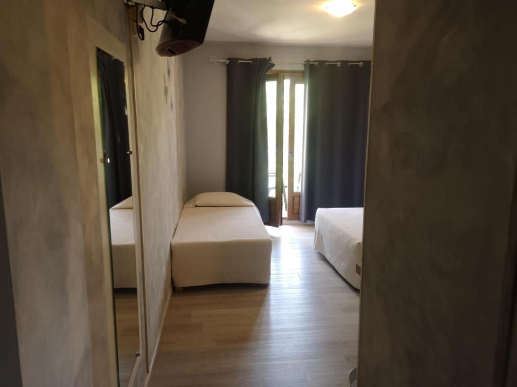 Postel nebo postele na pokoji v ubytování Hotel Cyrnea