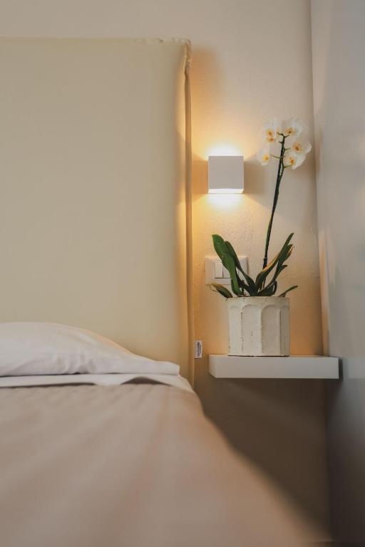 Postel nebo postele na pokoji v ubytování Hotel Eden