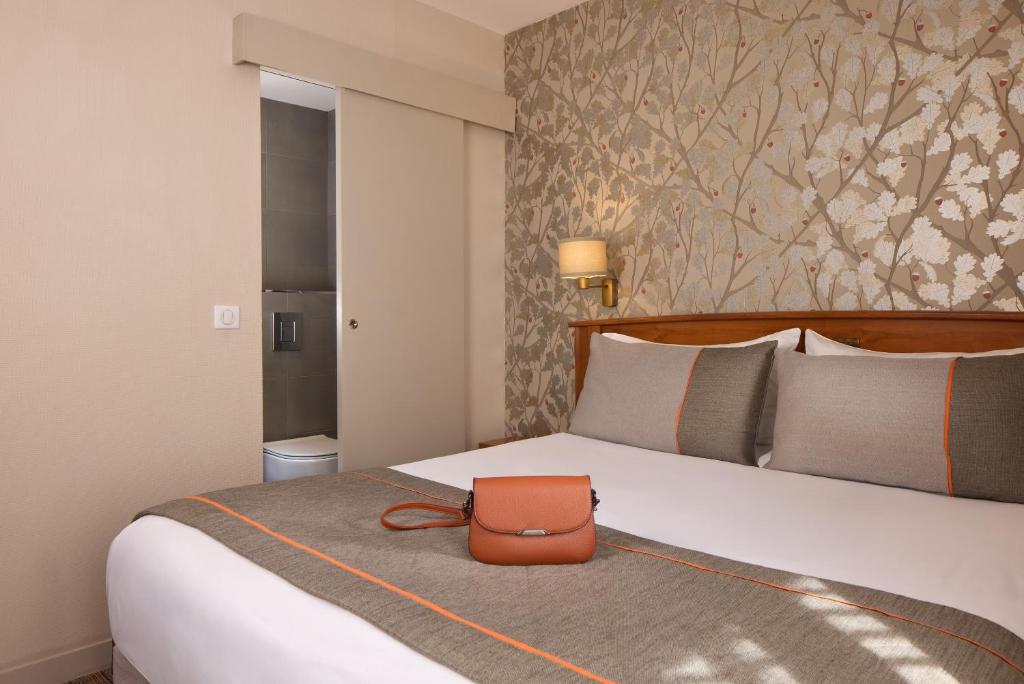 Postel nebo postele na pokoji v ubytování Timhotel Tour Eiffel