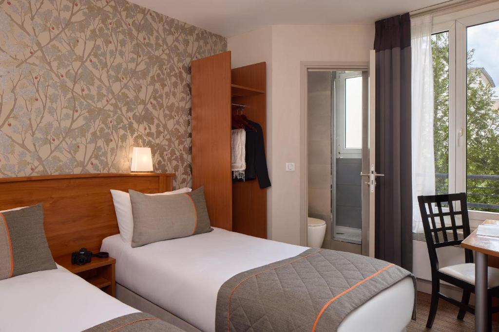 Postel nebo postele na pokoji v ubytování Timhotel Tour Eiffel