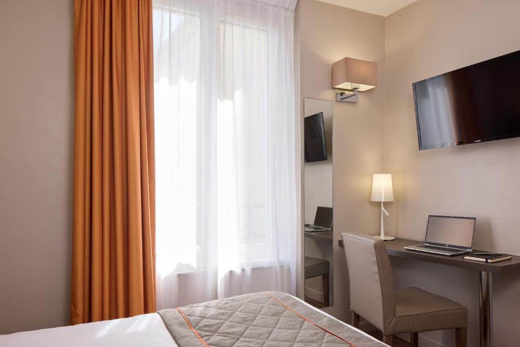 TV a/nebo společenská místnost v ubytování Timhotel Tour Eiffel