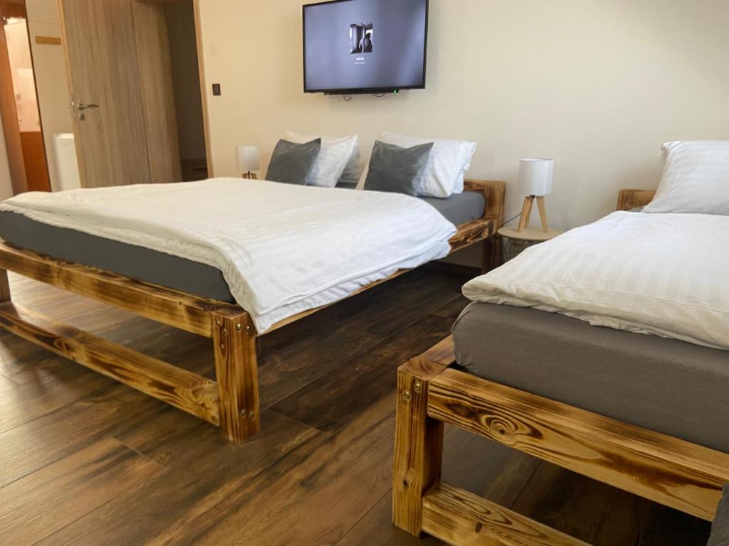 Postel nebo postele na pokoji v ubytování Apartmán KUGA