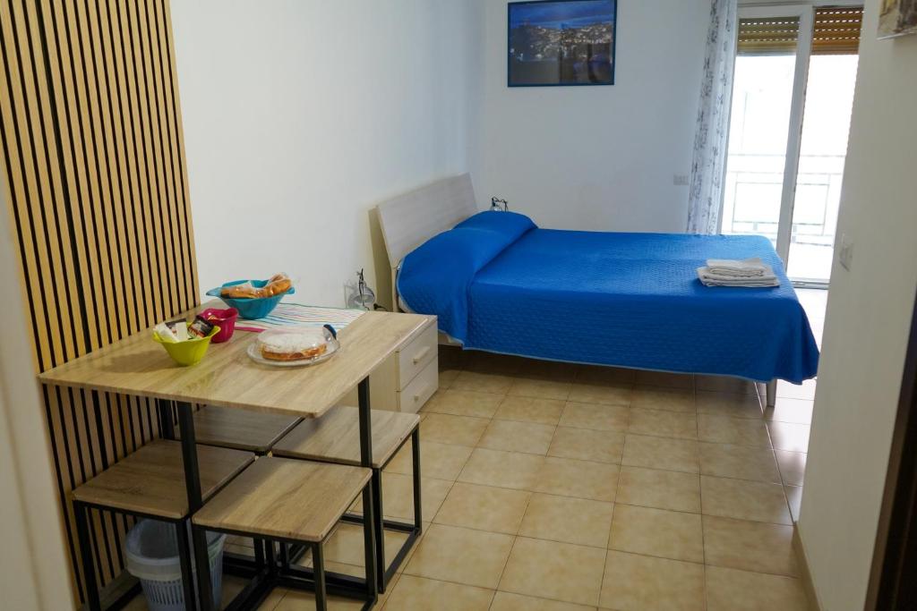A bed or beds in a room at B&B La Dimora di Rosa