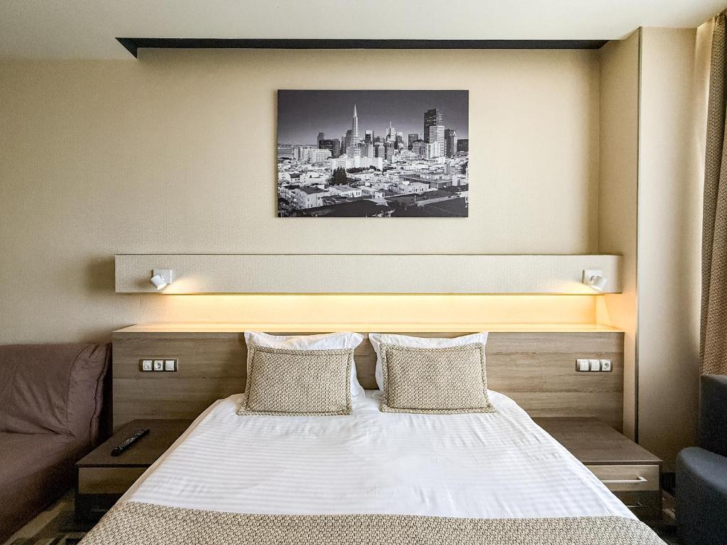 Postel nebo postele na pokoji v ubytování 12th Floor Apartments