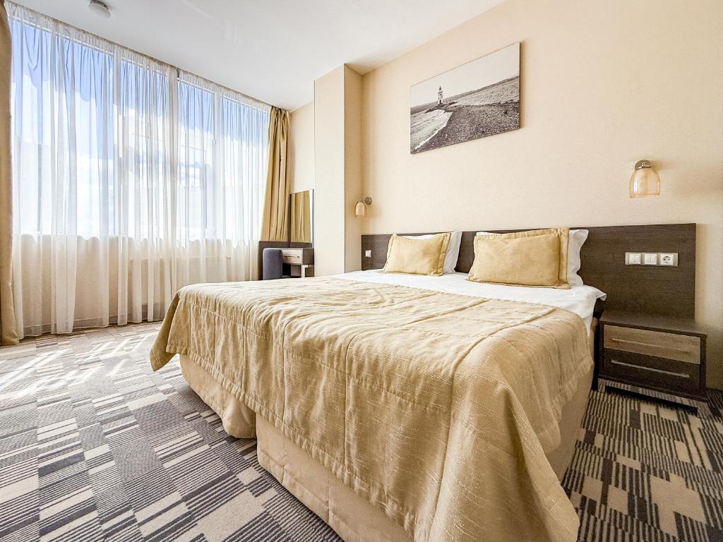 Postel nebo postele na pokoji v ubytování 12th Floor Apartments
