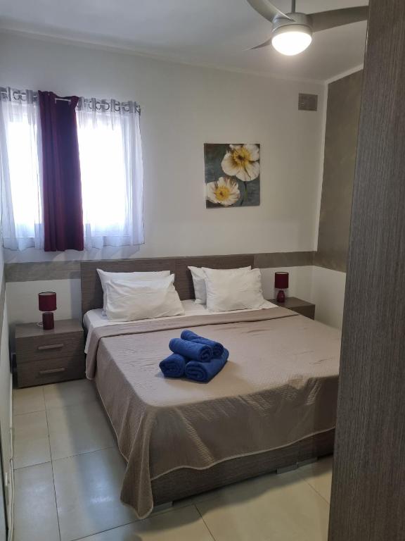 Postel nebo postele na pokoji v ubytování Central Suites