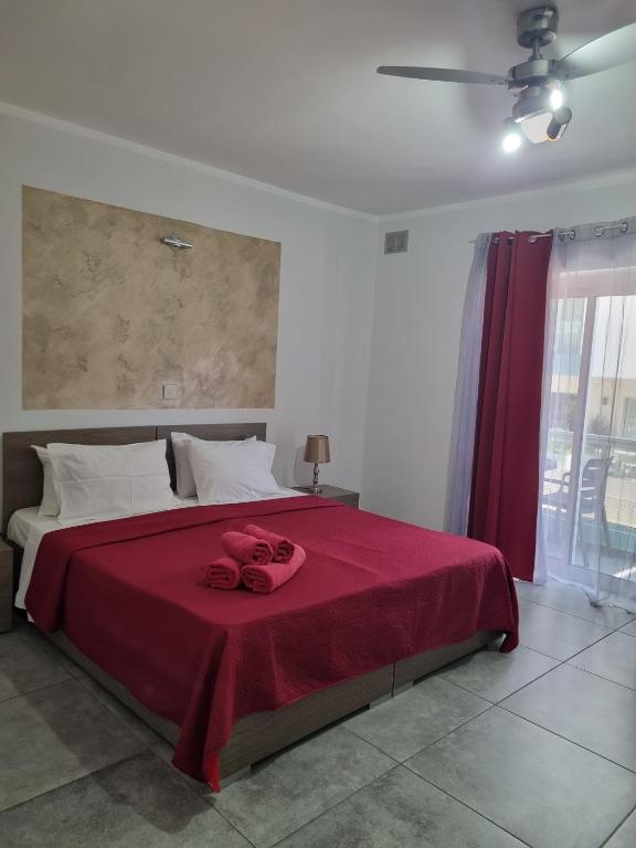 Postel nebo postele na pokoji v ubytování Central Suites