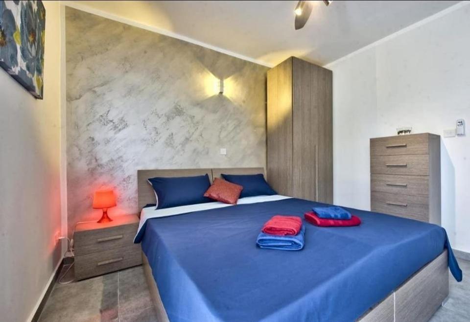 Postel nebo postele na pokoji v ubytování Central Suites