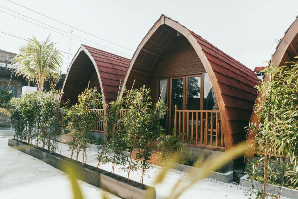 a small house with plants in front of it at Loka Sea View Glamping in Pengastulan