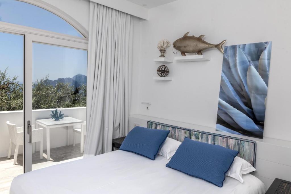 Postel nebo postele na pokoji v ubytování Relais Blu