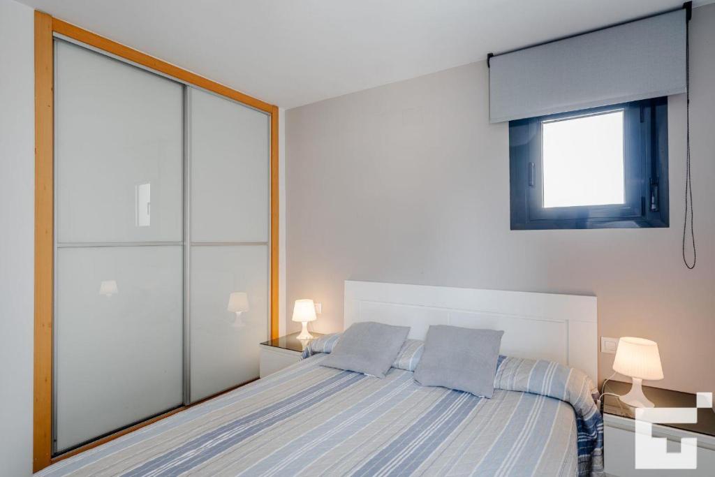 Posteľ alebo postele v izbe v ubytovaní Apartamento Bernia al Mar 9A - Grupo Turis