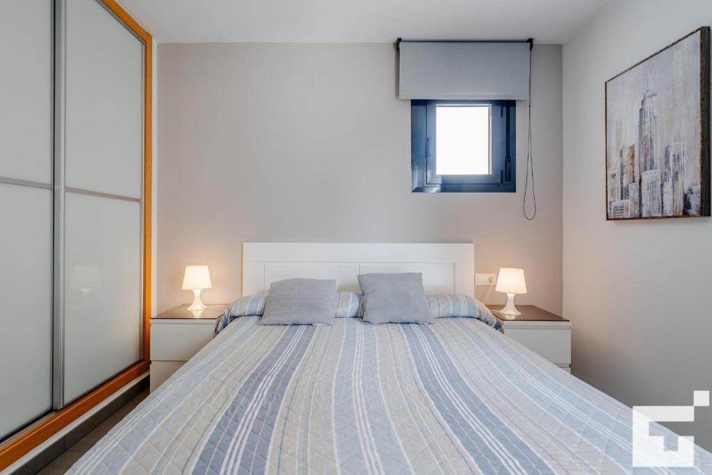Posteľ alebo postele v izbe v ubytovaní Apartamento Bernia al Mar 9A - Grupo Turis