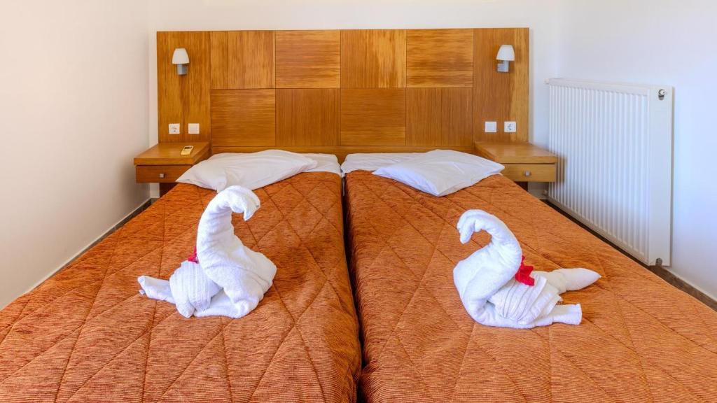 Postel nebo postele na pokoji v ubytování Sunrise Beach Ipsos