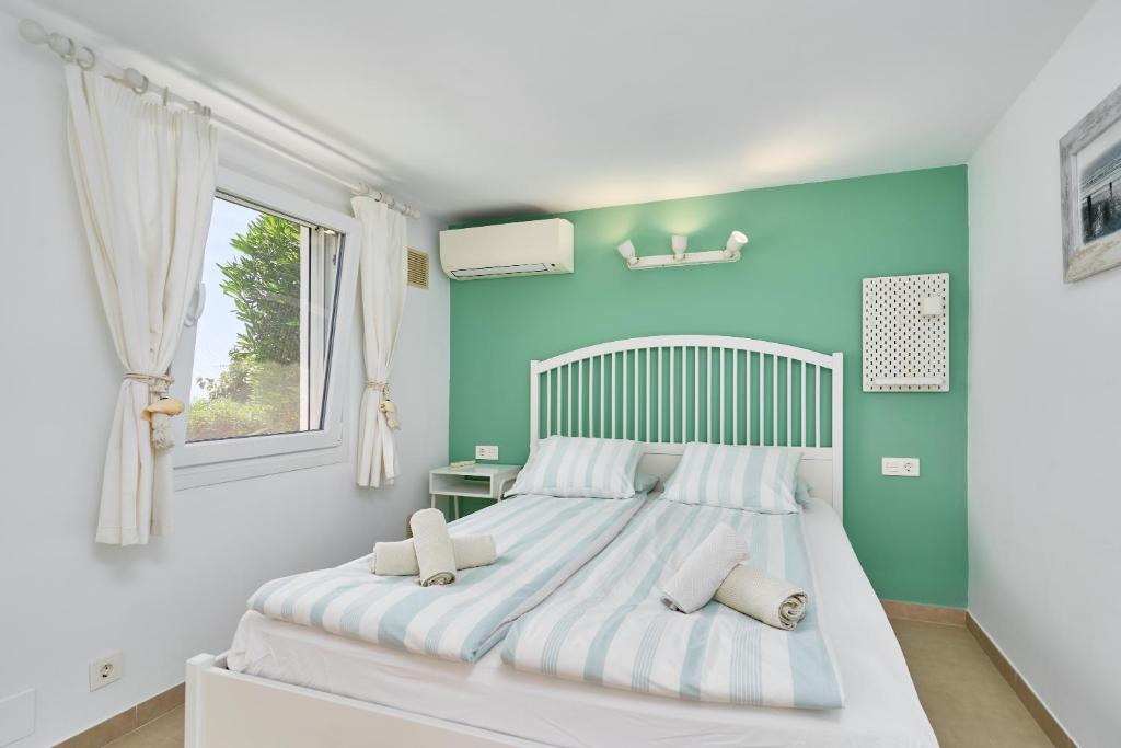 Postel nebo postele na pokoji v ubytování Villa La Chinita