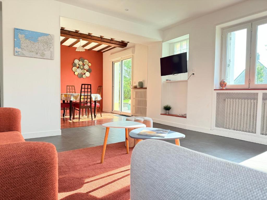 a living room with a couch and a table at La Renaissance in Bayeux