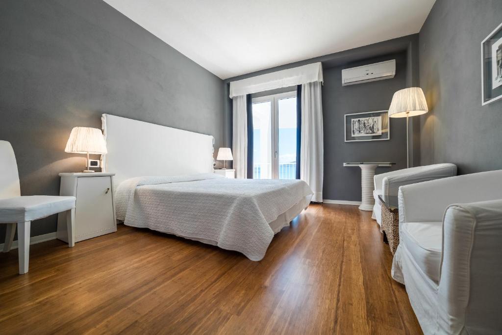 Кровать или кровати в номере Hotel Kalura