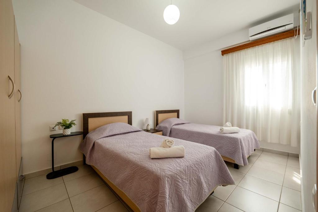 Postel nebo postele na pokoji v ubytování Dajana Apartments