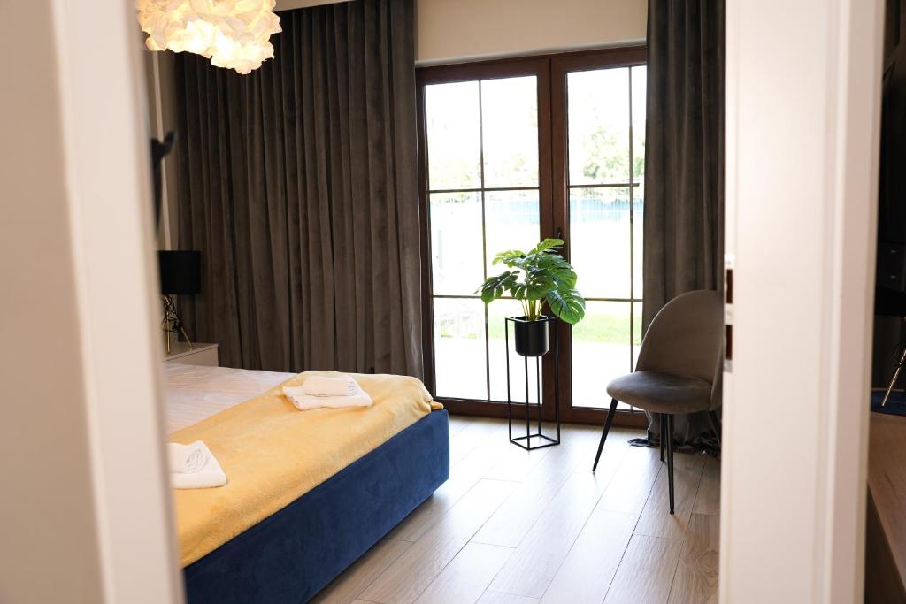 Posteľ alebo postele v izbe v ubytovaní Apartamenty na Dworskiej - BLISKO ENERGYLANDIA ZATORLAND