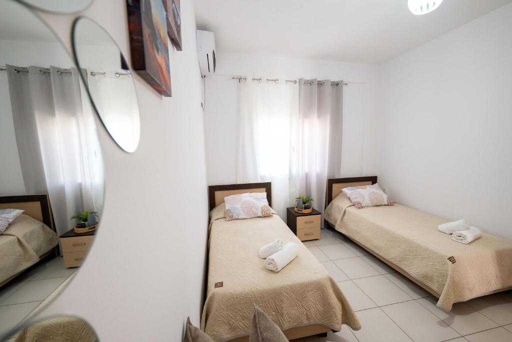 Postel nebo postele na pokoji v ubytování Dajana Apartments