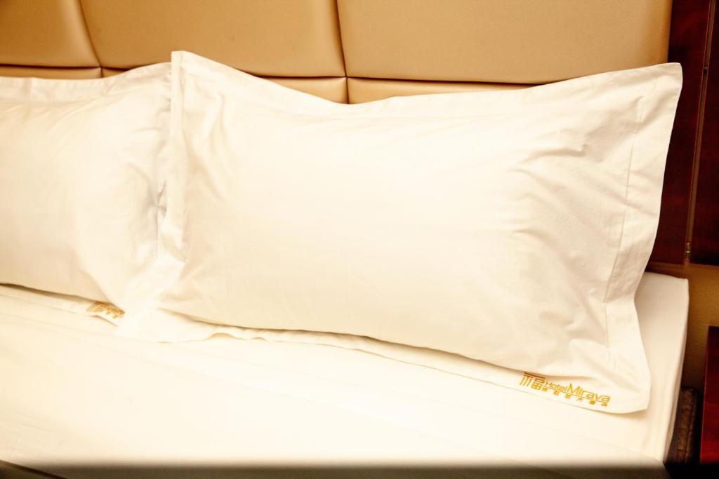 Postel nebo postele na pokoji v ubytování Hotel Mirava