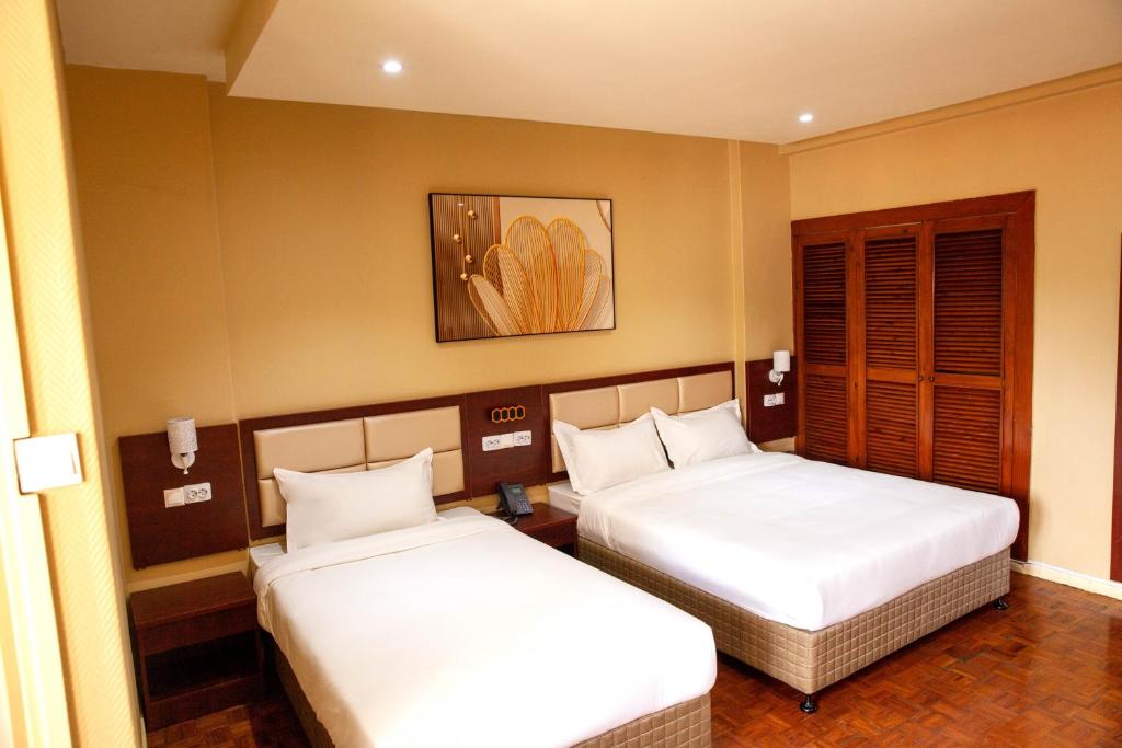 Postel nebo postele na pokoji v ubytování Hotel Mirava