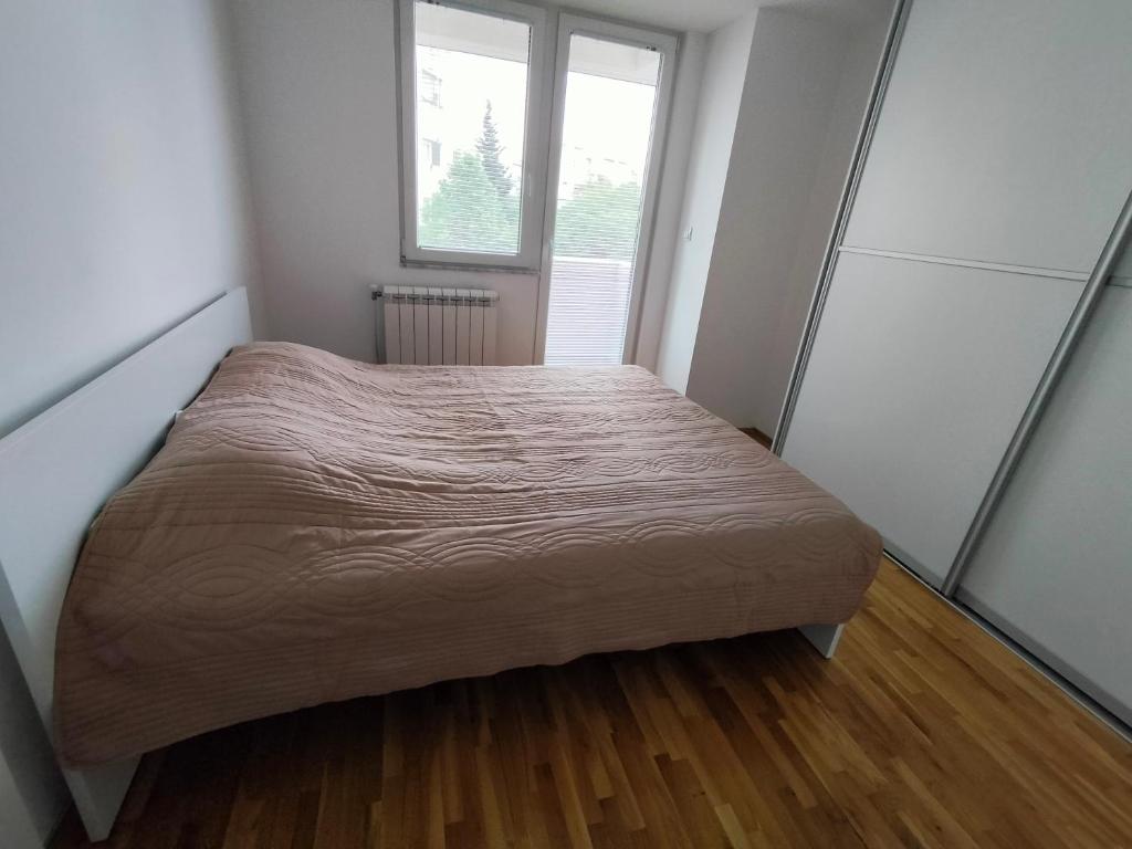 Postel nebo postele na pokoji v ubytování DB Apartment