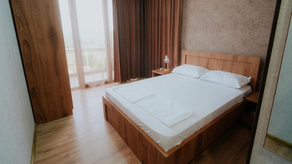 Postel nebo postele na pokoji v ubytování Villa Ikalto