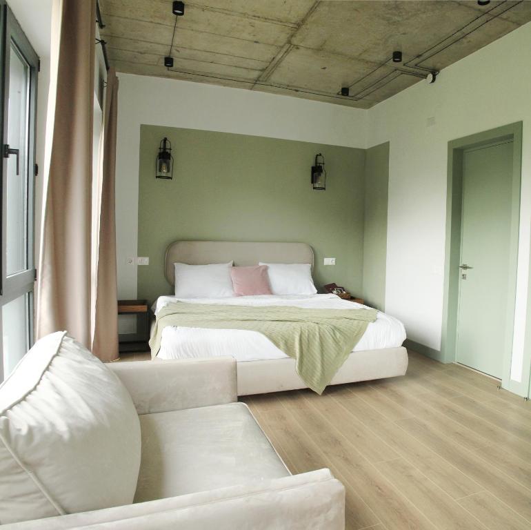 Postel nebo postele na pokoji v ubytování Hover Boutique Hotel
